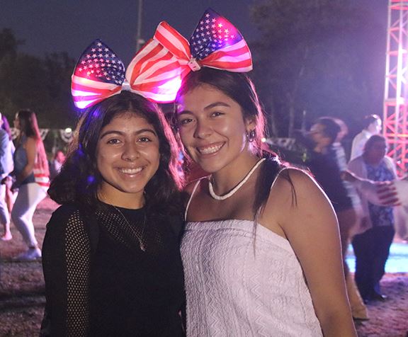 two girls with American flag bows in their hair