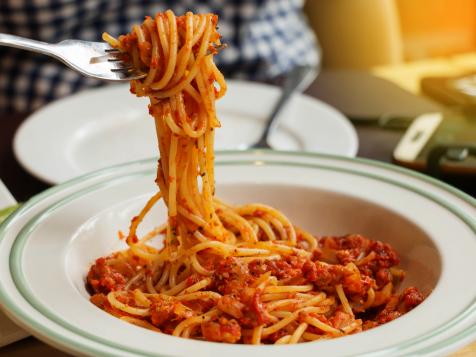 bowl of pasta with tomato sauce and fork